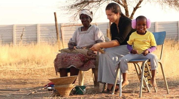 A student weaving a basket in Botswana